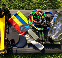 Load image into Gallery viewer, Deluxe Fitness Kit includes Jump Rope, Core Sliders, Towel, 5 Mini Resistance Bands, Water Bottle, Muscle Massage Stick, 11 piece Resistance Tube Set, Agility Ladder, Yoga Mat
